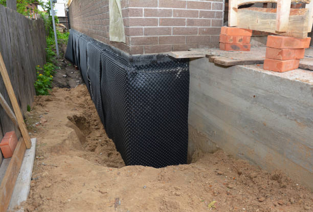 Happy homeowners after waterproofing job in Granger